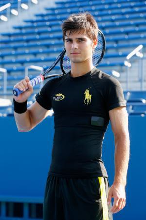 Marcos Giron shows off the new $200 Polo Tech, which uses sensors and a removable electronics pack to track all of an athlete's vitals... and a tight, stretchable knit to show off all of the athlete's six pack.