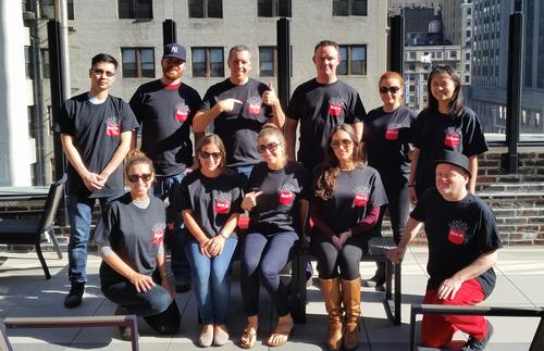 The Light Reading New York crew model the first New IP T-Shirt on the patio of our opulent midtown office.