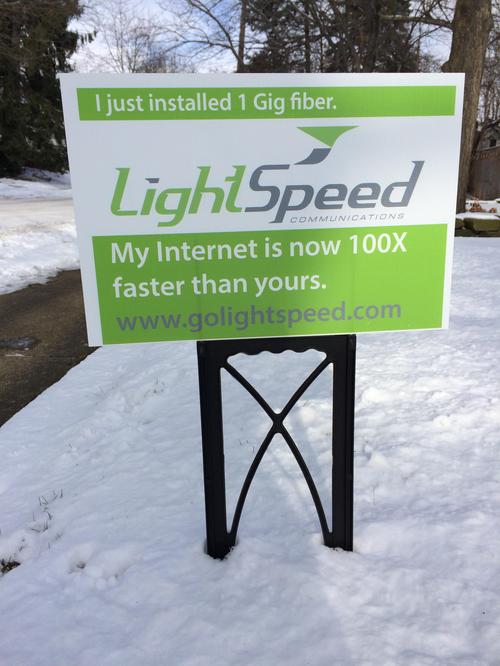 Part of LightSpeed's marketing effort is to give customers lawn signs that taunt their neighbors.