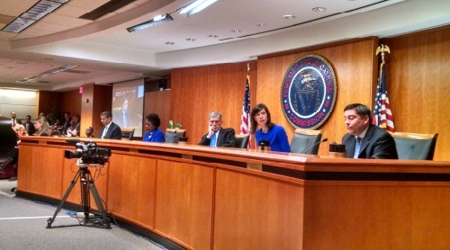 Flanked by his two Democratic colleagues in blue, FCC Chairman Tom Wheeler (third from right) shepherded tough net neutrality rules through a sharply divided Commission.