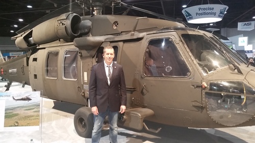 Light Reading CEO Stephen Saunders poses alongside a Sikorsky helicopter at the Unmanned Systems 2015 show in Atlanta, Ga.
