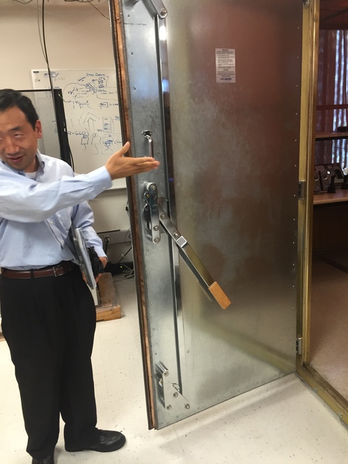 Mingxi Fan, Qualcomm VP of engineering and corporate R&D, beckons us to enter his torture chamber. Click on the photo for a brief slideshow of our visit to Qualcomm.