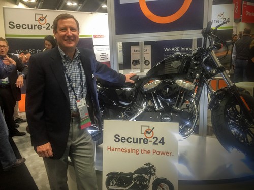 Secure-24 CEO Michael Jennings. The company gave away this motorcycle at its booth at Oracle OpenWorld recently. Jennings says he likes dirt bikes.