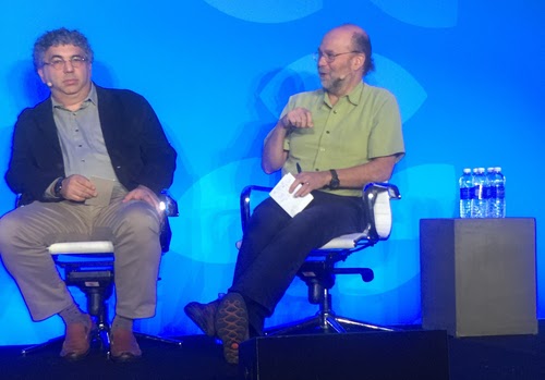 Jeff Mogul, Google's principal software engineer (right), discusses building reliable services from unreliable parts, while Hal Stern, executive director of applied technology for Merck, listens.