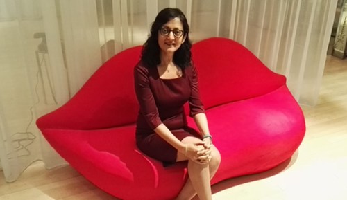 Ericsson chief strategy officer Rima Qureshi finds a comfortable seat for the London interview.