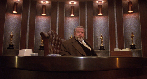 Orson Welles in The Muppet Movie worked at a desk. He'd be a unified communications customer today if he weren't dead.