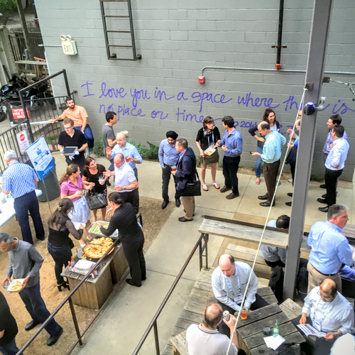Conference goers connect, eat, drink and discuss the day's events at the BCE kickoff party after the first day's programming. (Photo: Carol Wilson)