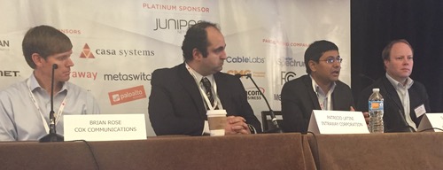 (Left to right) Cox's Brian Rose, Intraway's Patricio Latini and (far right) MEF's Stan Hubbard listen as Satya Parimi explains Charter's ambitious enterprise plans.