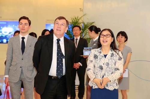 UK Secretary of State for Culture, Media and Sport John Whittingdale, middle, and Huawei Chairwoman Sun Yafang tour the Huawei Exhibition Hall on Friday.