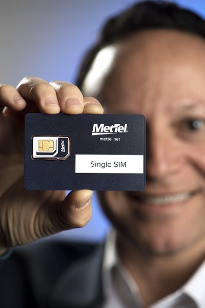 MetTel VP for Mobility and IoT Max Silber displays the IoT Single SIM which self-reports real-time on-session activity, providing a current view of product/component status and location. (Photo source: Jon Simon/Feature Photo Service for MetTel)