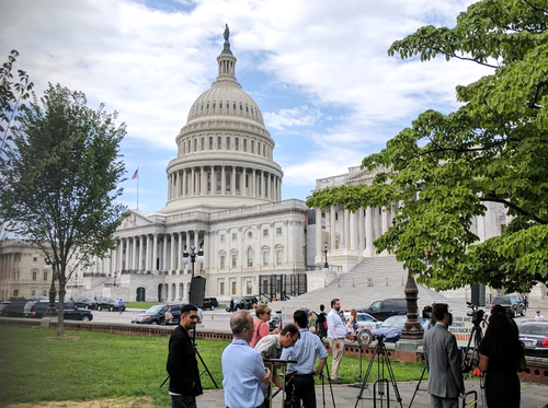 Net neutrality advocates prepare ahead of a press conference in the so-called 'Senate Swamp.'