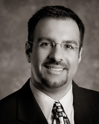 Guavus CEO Faizel Lakhani, corporate headshot.

