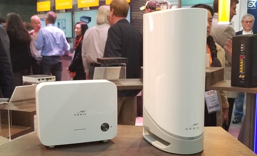 Arris said its new WiFi 6-capable DOCSIS 3.1 gateway (pictured at right) can work with 'EasyMesh'-certified WiFi extenders from Arris (pictured at left) or from third parties.