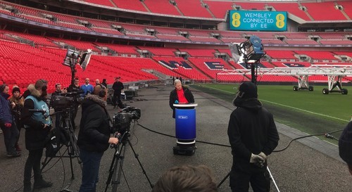 BT Sport Presenter Matt Smith participates in a demonstration of 5G technology at London's Wembley Stadium.