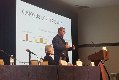 Rasmus Aveskogh (standing) said Com Hem has added machine learning techniques to a customer experience initiative that the Sweden-based service provider undertook in 2014. Light Reading's Alan Breznick is the person joining Aveskogh on stage.