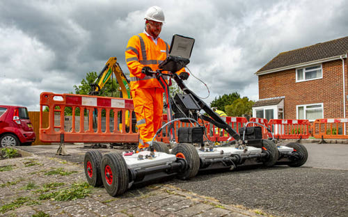 An Openreach engineer uses GPR technology to detect hidden obstacles before digging in fiber cables, in Salisbury.