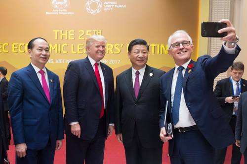 Donald Trump and Xi Jinping are 'selfied' by former Australian Prime Minister Malcolm Turnbull.