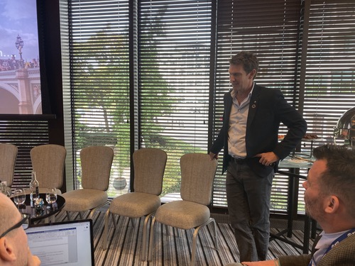 NTT Ltd CEO Jason Goodall takes questions from reporters at a press briefing in London.