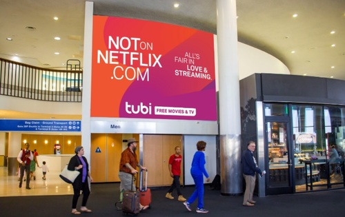 The billboard element of Tubi's ad campaign is focused on New York and Los Angeles, including airports such as JFK and LAX. Pictured is a billboard mock-up for LAX.