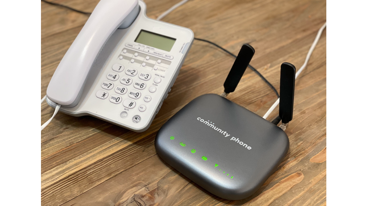 The Community Phone receiver base, on the right, plugs into power and connects to a mobile network. Users can then plug their existing, landline phone into the device in order to continue making traditional landline calls. (Source: Community Phone)