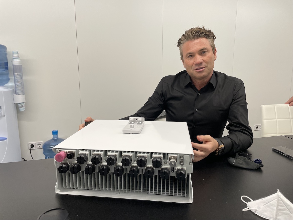 Rakuten's Tareq Amin showing off a radio kit at Mobile World Congress 2022. (Source: Iain Morris/Light Reading)