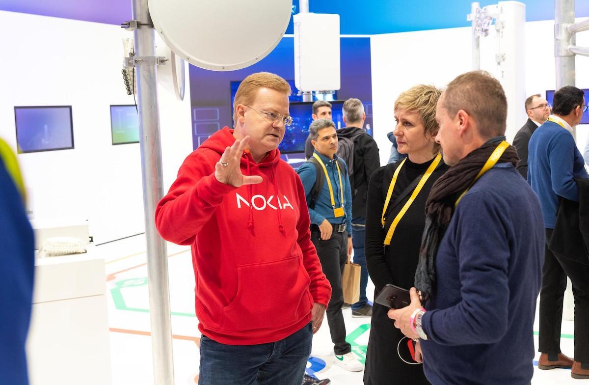 Nokia's Tommi Uitto talks to customers at Mobile World Congress. (Source: Nokia)