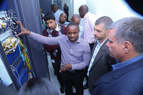 Safaricom SME - Co-Network services, Andrew Masila (left) chats with Safaricom Technology Director Thiboud Rerolle (center) and Safaricom Financial Services Director Ronald Webb (right) about the operator's cloud platform. 