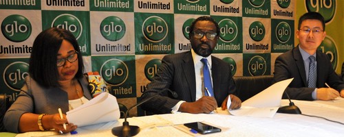 Executives sign the Glo2 construction deal. From left to right: Globacom's Executive Director, Legal, Gladys Talabi; Globacom's Folu Aderibigbe; and Li Shaowei, Deputy Managing Director at Huawei Technologies. 