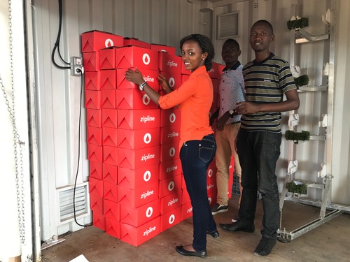 Zipline staff with the secure blood packages transported by drone. 