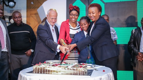 From the left: Safaricom Former CEO and Board Member Michael Joseph cuts the cake with Maggie Wazome, Mpesa Foundation Academy Sharon Wanjiru, and Safaricom Director Special Projects Sylvia Mulinge during the 'Safaricom at 18' celebrations.