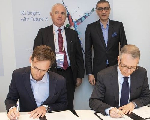 Executives from Rain and Nokia sign their 5G agreement. Back row, from left to right: Paul Harris, chairman of Rain; and Rajeev Suri, president and CEO, Nokia. Front row, from left to right:  Brandon Leigh, director, Rain; and Amr K. El Leithy, head of the Middle East and Africa market, Nokia. 