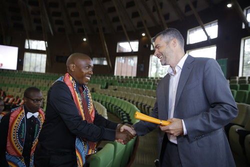 Safaricom Digital Academy graduates receive certificates from former Chief Technical Officer Thibaud Rerolle.