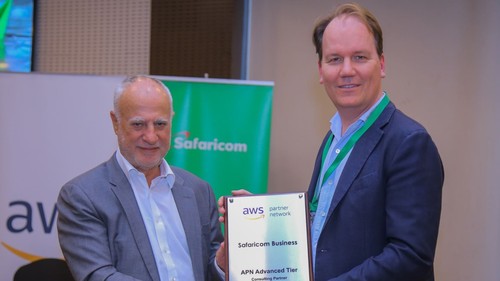 Safaricom CEO Michael Joseph accepts a partnership plaque from Amazon Web Services' managing director for emerging markets, Tony van den Berge. 