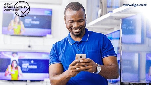 Tigo Pesa customers can now transact with people in Kenya, Uganda and Rwanda even if they use a different mobile money service. (Picture courtesy of Tigo Pesa.)