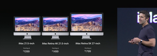 John Ternus, vice president for hardware engineering, shows off new iMacs.