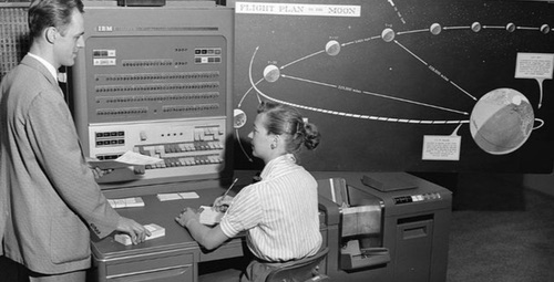 A human computer (right) works on an IBM 704 machine computer at NASA Jet Propulsion Laboratory. Photo source: NASA