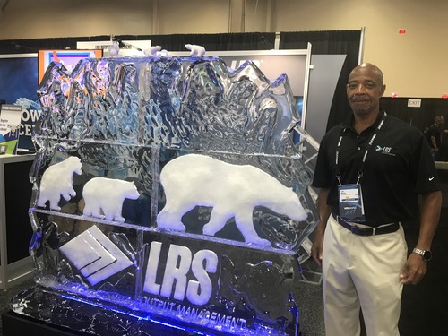 LRS Output Management had an actual ice sculpture at its booth. LRS's Lee Martin (in photo) told me they had one sculpture for each day of the conference, made by a local Las Vegas company.