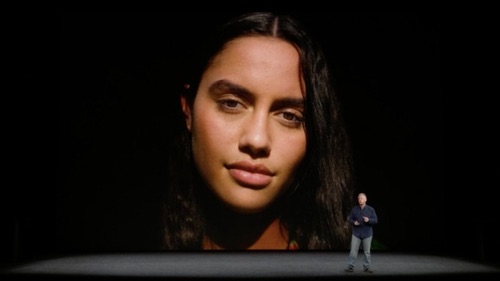 Phil Schiller, Apple senior vice president of worldwide marketing (the tiny man on the right), shows off the new portrait lighting feature on the iPhone 8.