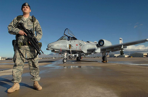 United States Air Force 355th Security Force Squadron guardsman, Senior Airman Mario Fajardo, stands guard at Davis-Monthan Air Force Base.